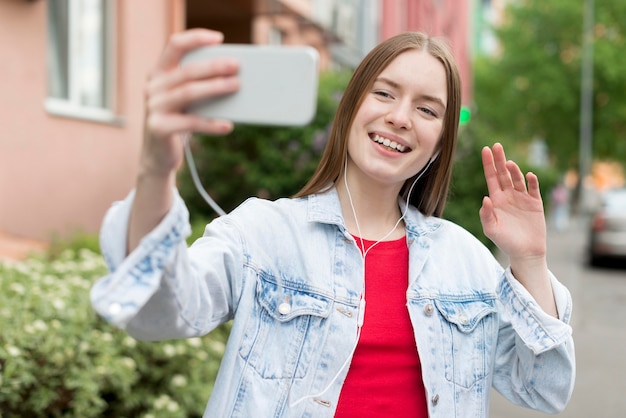 Free Photo happy woman taking a selfie