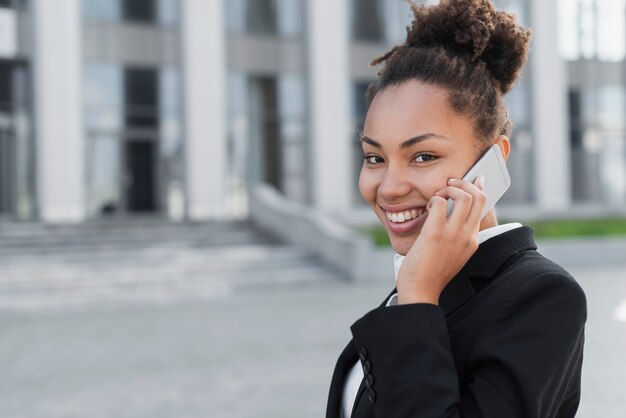 Happy woman talking on phone