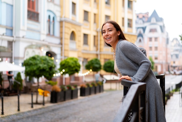 Free photo happy woman at the terrace