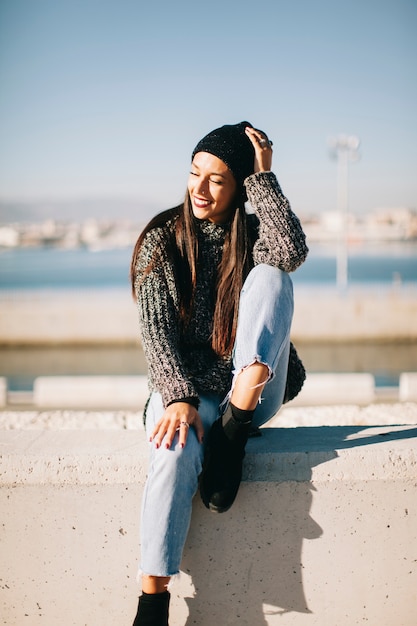 Free photo happy woman in urban environment