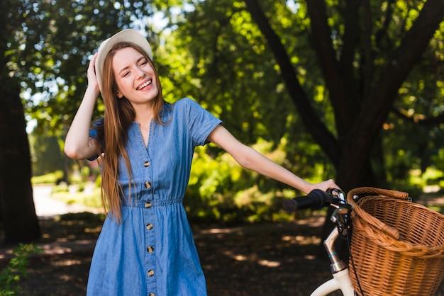 Free Photo happy woman with bicycle