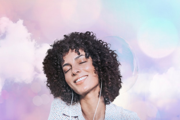 Free photo happy woman with curly hair wearing earphones remixed media with pastel bokeh lights effect