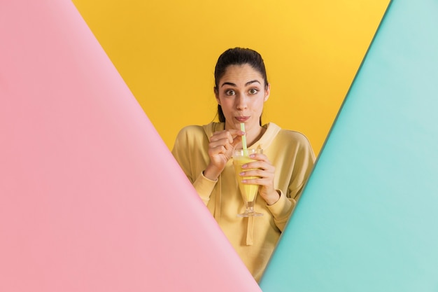 Free photo happy woman with a glass of juice