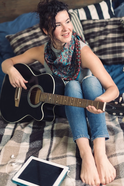 Happy woman with guitar