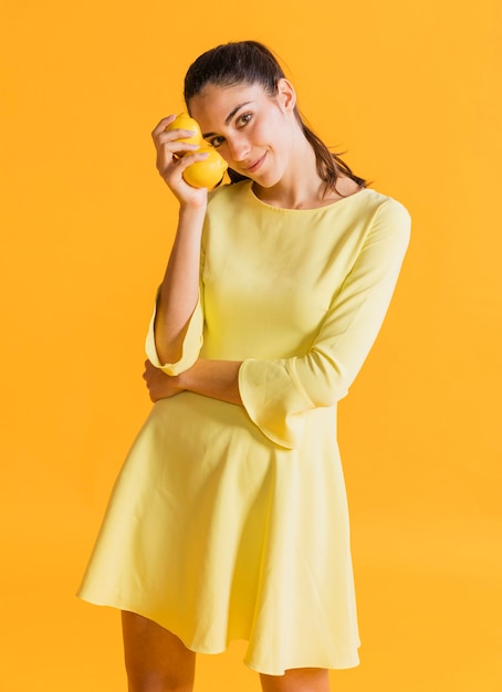 Free photo happy woman with lemons