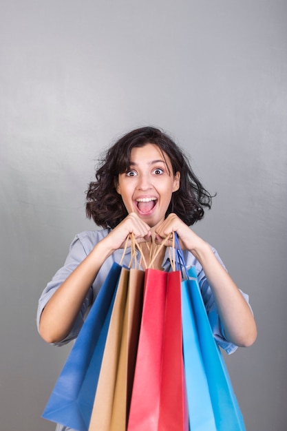 Happy woman with shopping bags