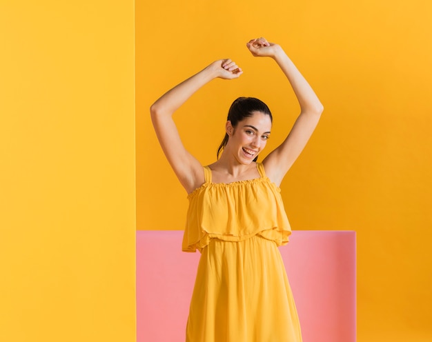 Free photo happy woman in yellow dress