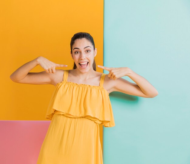 Happy woman in yellow dress