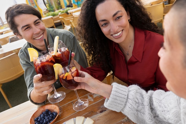 Happy women with sangria high angle