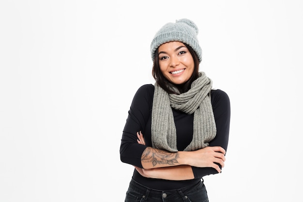 Happy young asian lady wearing warm hat and scarf