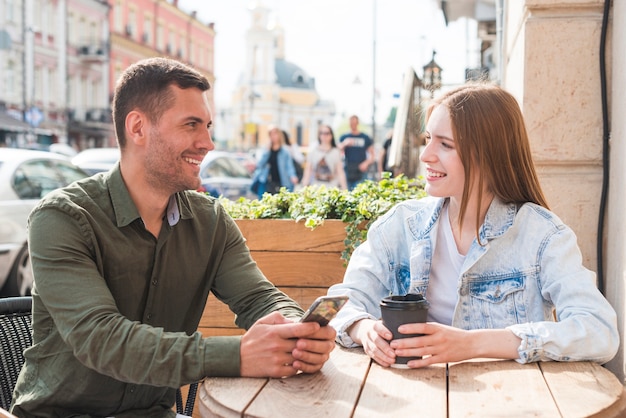 Happy young couple having a romantic date in caf�