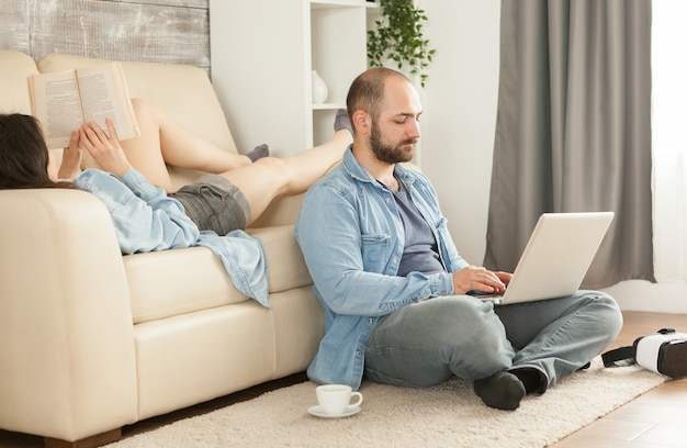 Happy young family relaxing in living room