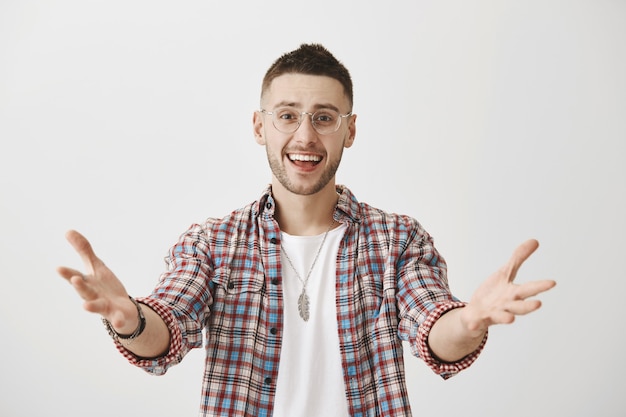 Free Photo happy young guy with glasses posing