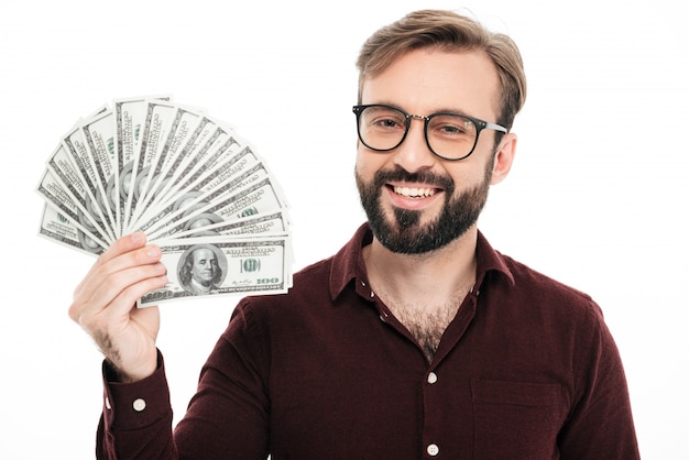 Happy young man holding money.