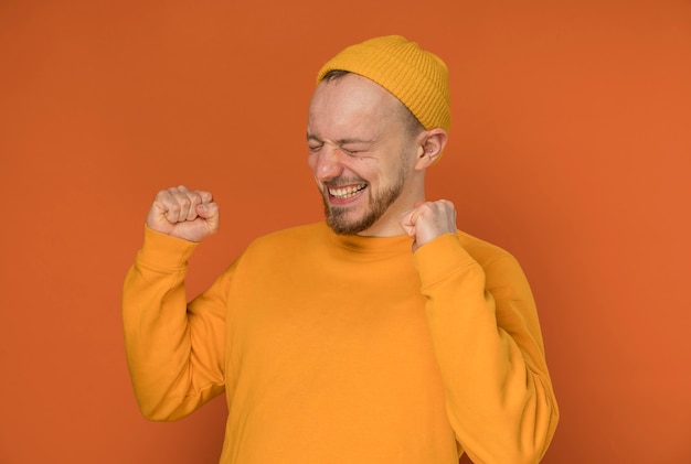 Free photo happy young man laughing