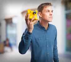 Free photo happy young-man with piggy-bank