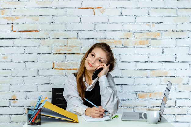 Happy young student talking on the phone High quality photo