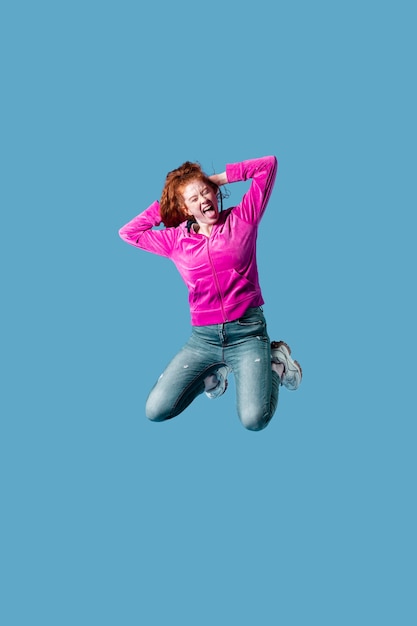 Happy young woman jumping