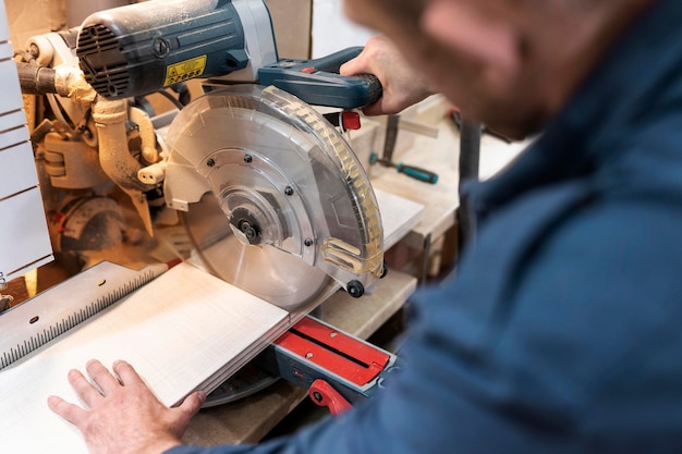 Hardworking man doing his job in a woodshop