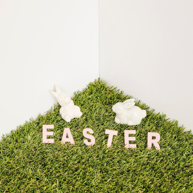 Free photo hare figurines and easter word