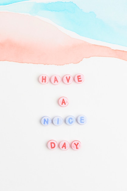 Free Photo have a nice day beads text typography on pastel