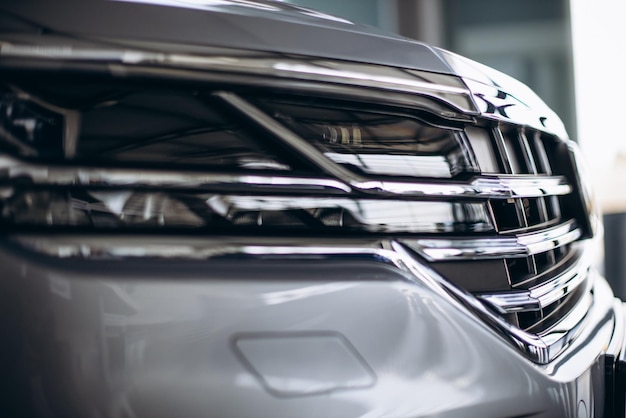 Headlights in a new car in car showroom