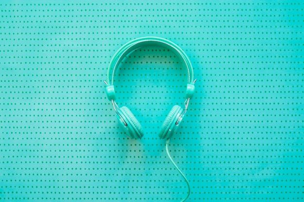 Free photo headphones on turquoise background