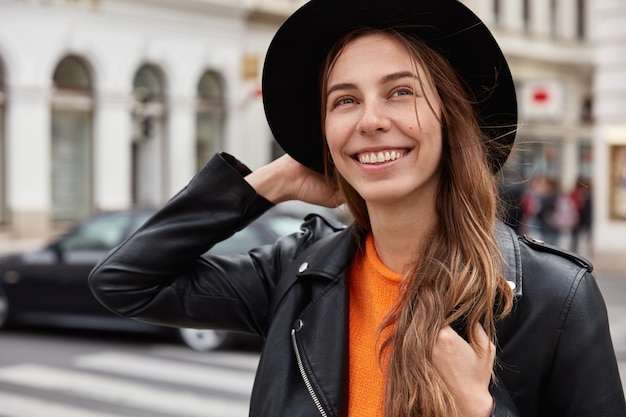 Free photo headshot of optimistic european woman feels free and delighted