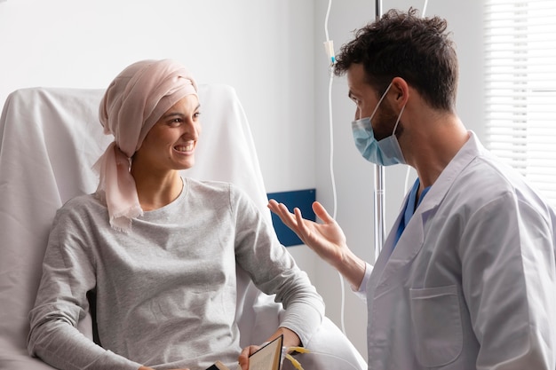 Health assistant taking care of a female patient