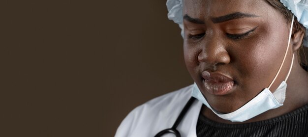 Health worker with medical mask and copy space