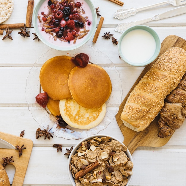 Healthy breakfast concept with pancakes and cereals