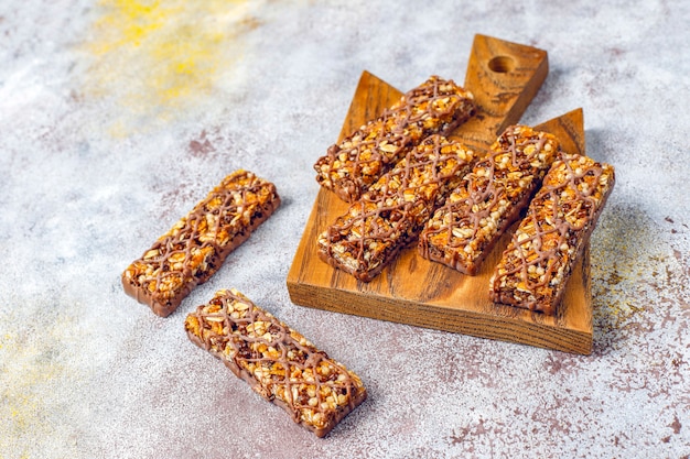 Healthy delicios granola bars with chocolate, muesli bars with nuts and dry fruits, top view