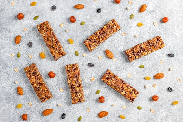 Free Photo healthy delicios granola bars with chocolate,muesli bars with nuts and dry fruits,top view