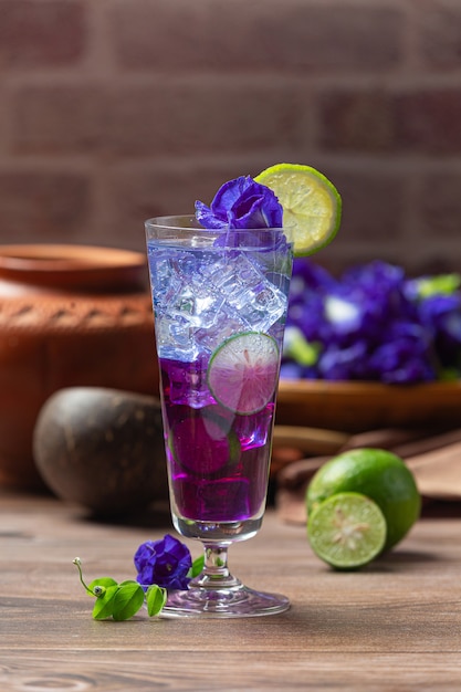 Healthy drink, organic blue pea flower tea with lemon and lime.