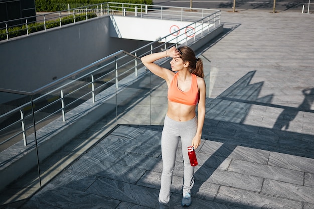 A healthy female is doing exercise outdoor