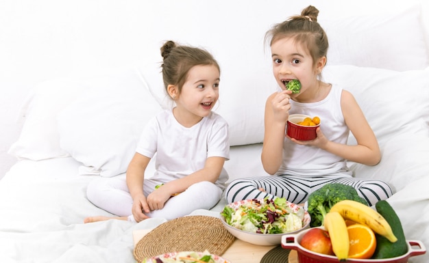 Healthy food, children eat fruits and vegetables.