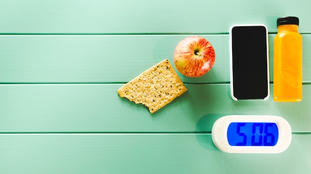 Free Photo healthy food composition with alarm clock