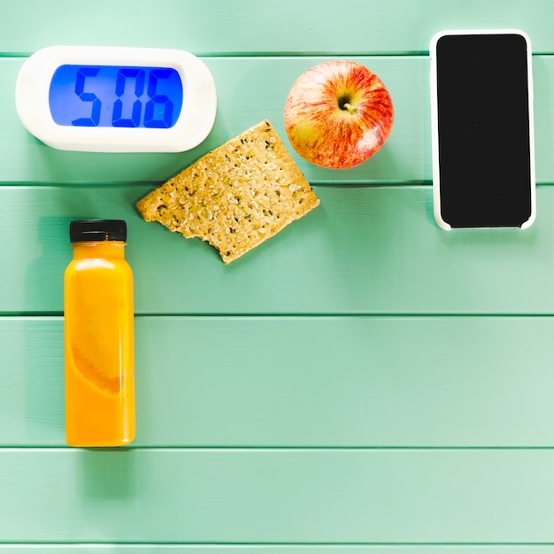 Free Photo healthy food composition with alarm