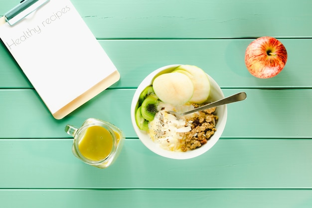 Healthy food concept with clipboard and bowl of cereals