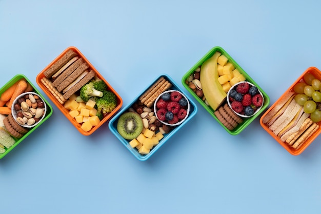 Healthy food lunch boxes assortment above view