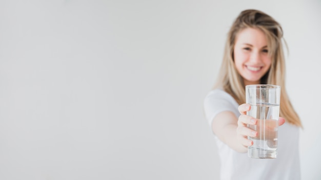 Free photo healthy girl holding glass of water