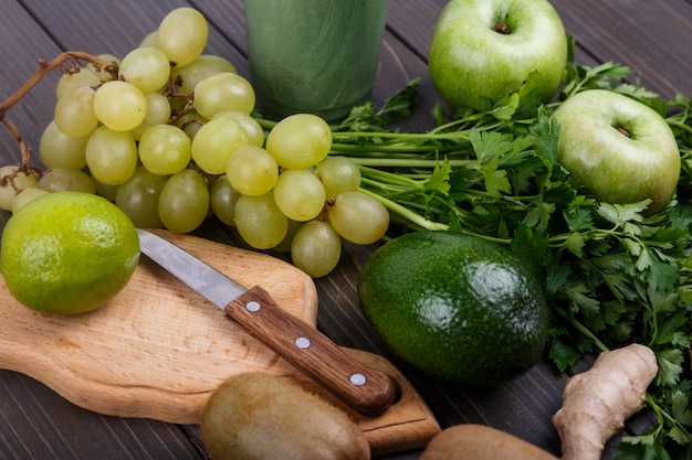 healthy green vegetables and fruits for smoothie lie on the table