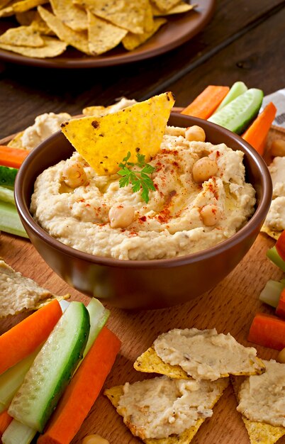 Healthy homemade  hummus with olive oil and pita chips