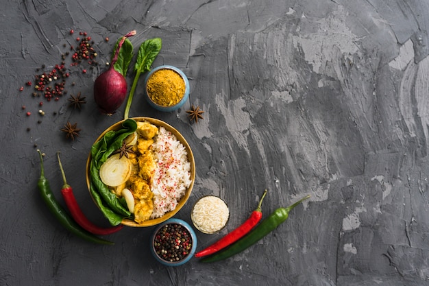 Healthy meal of rice with ingredients over rough cement surface