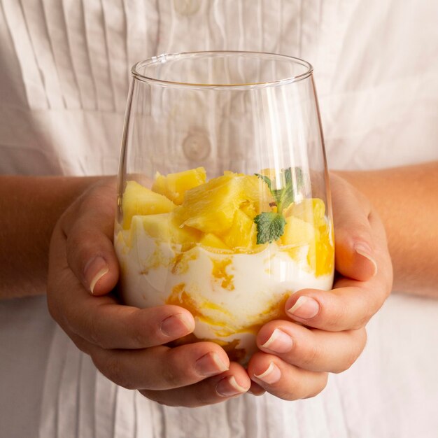 Healthy meal with yogurt and pineapple in glass