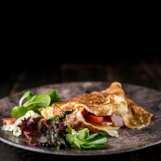 Free Photo healthy omelette on dark plate