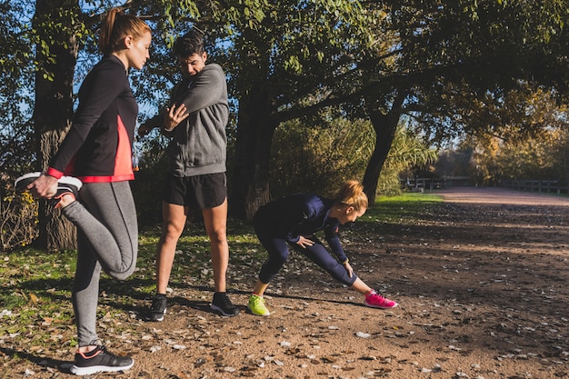 Free photo healthy people stretching different muscles