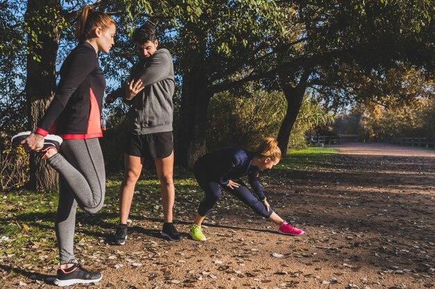 Healthy people stretching different muscles