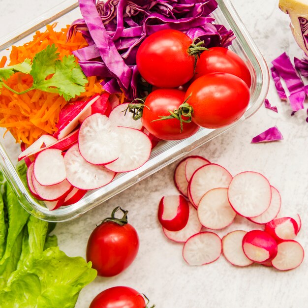 Healthy salad ingredients in plastic container