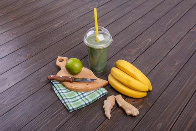 healthy smoothie with bananas,lime and ginger lie on the table